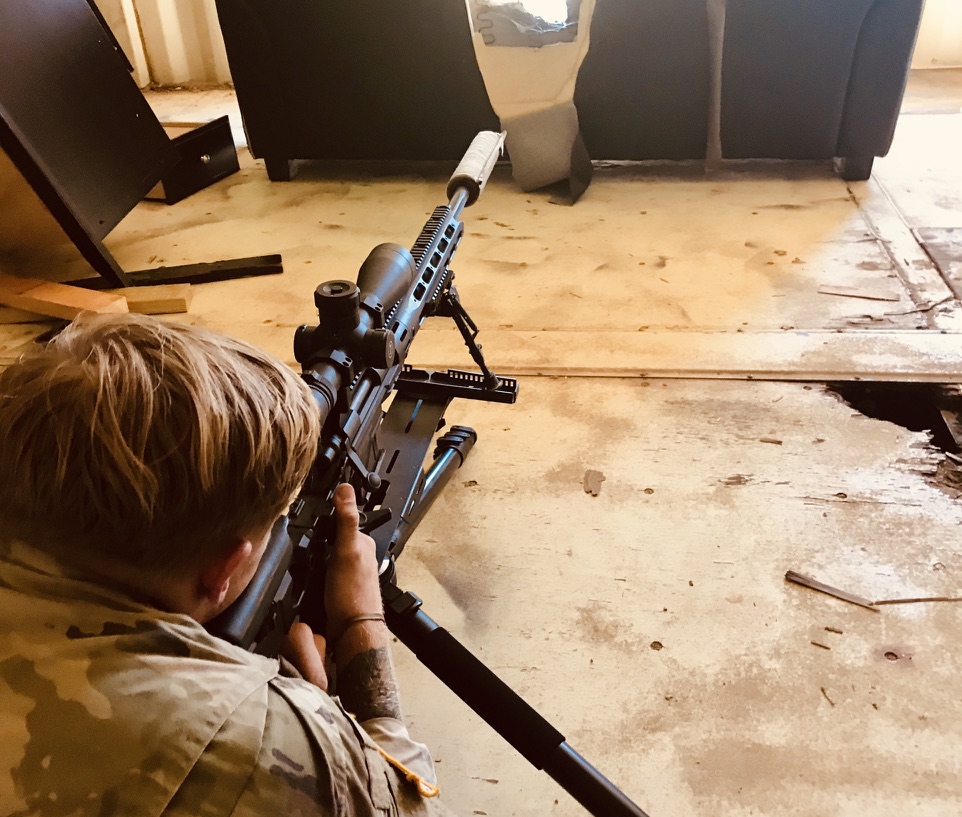 Shooter aiming through an obstacle opening