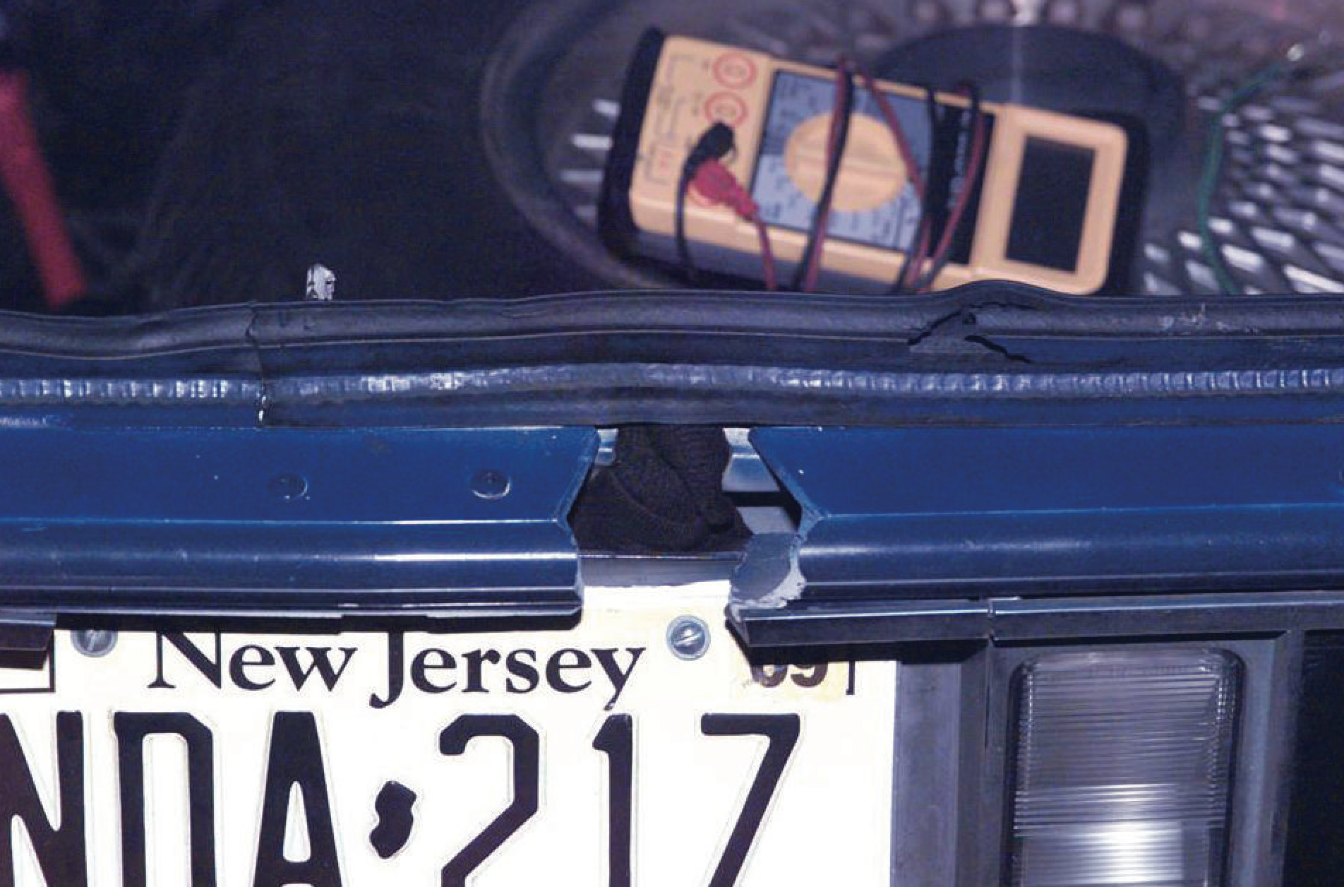 Firing port cut in the trunk lid of the 1990 Chevrolet Caprice used by Muhammad and Malvo