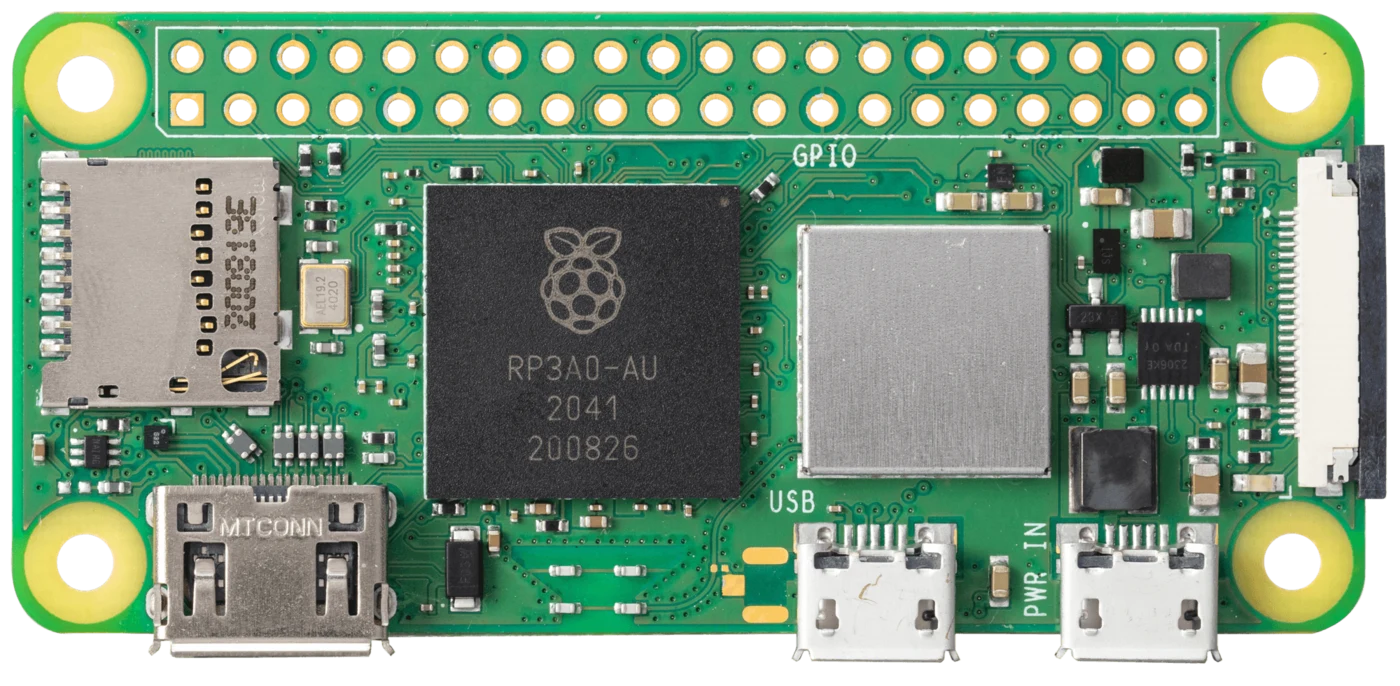 Raspberry Pi Zero 2 W board seen flat from above: unpopulated 40-pin GPIO holes along the top, microSD and mini-HDMI on the left, RP3A0 processor center, wireless shield beside it, USB and PWR IN micro-USB ports at the bottom, camera connector on the right edge